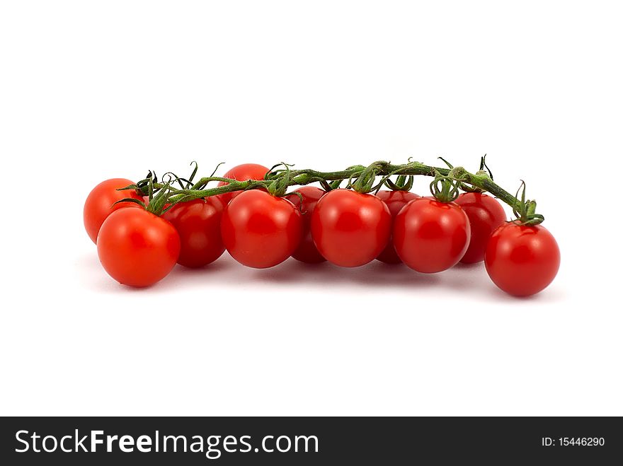 Close up of red tomatoes isolated over white.
