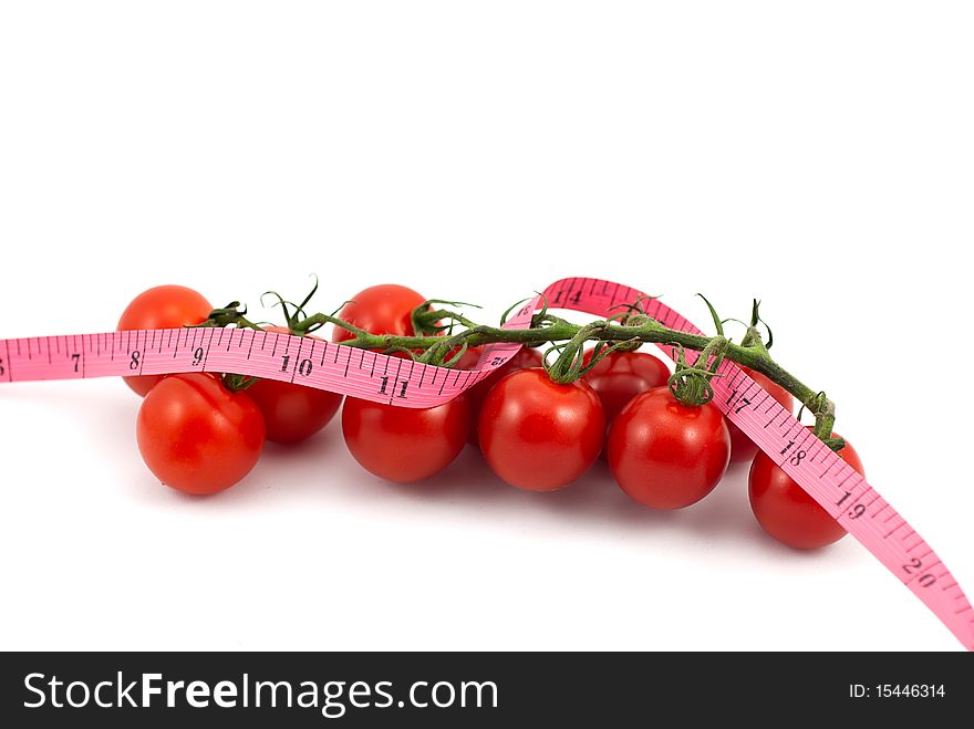Fresh Tomato with measuring tape on white background. Fresh Tomato with measuring tape on white background