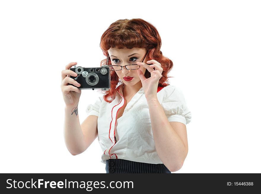 A sexy pin up librarian with a vintage camera. A sexy pin up librarian with a vintage camera.