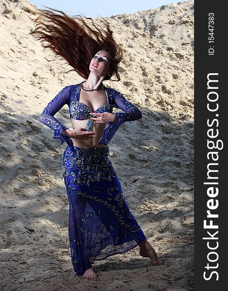 Belly dancer on the sand