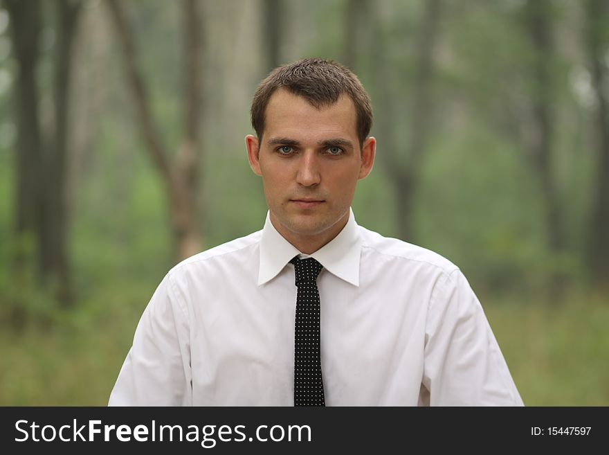 Portrait of young attractive man, outdoors