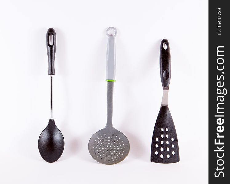 Kitchen utensils on light background