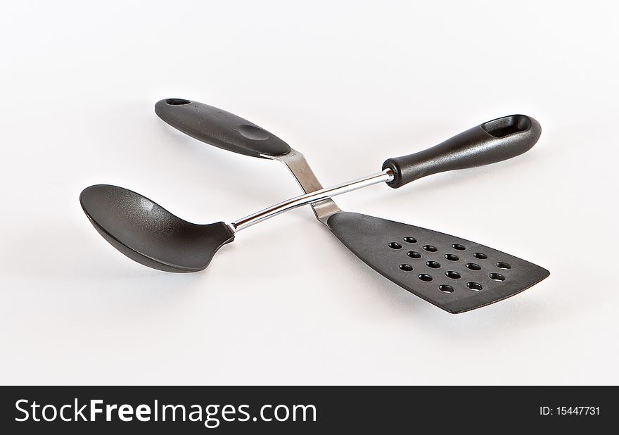 Kitchen utensils on light background