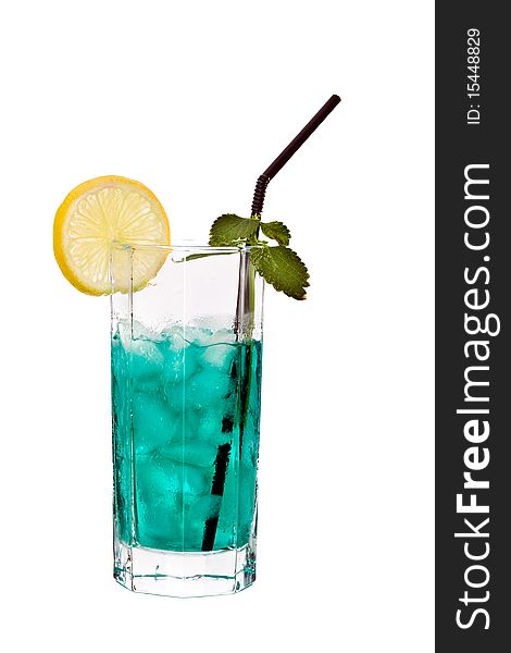 Green alcohol cocktail with mint and slice of lemon in glass. Green alcohol cocktail with mint and slice of lemon in glass