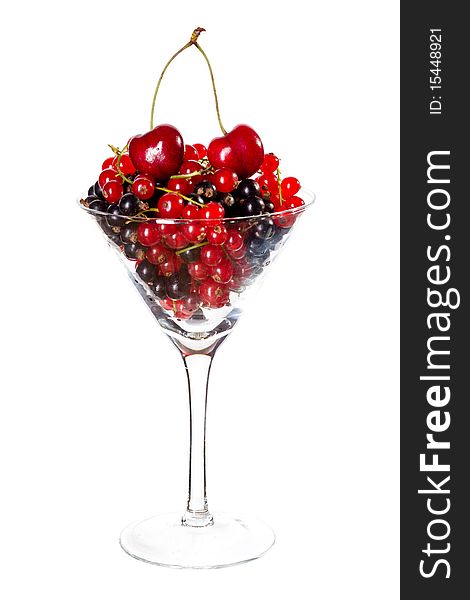 Red and black currants in glass isolated on white. Red and black currants in glass isolated on white