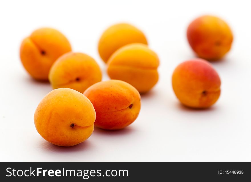 Close-up of  ripe apricots isolated on white background.