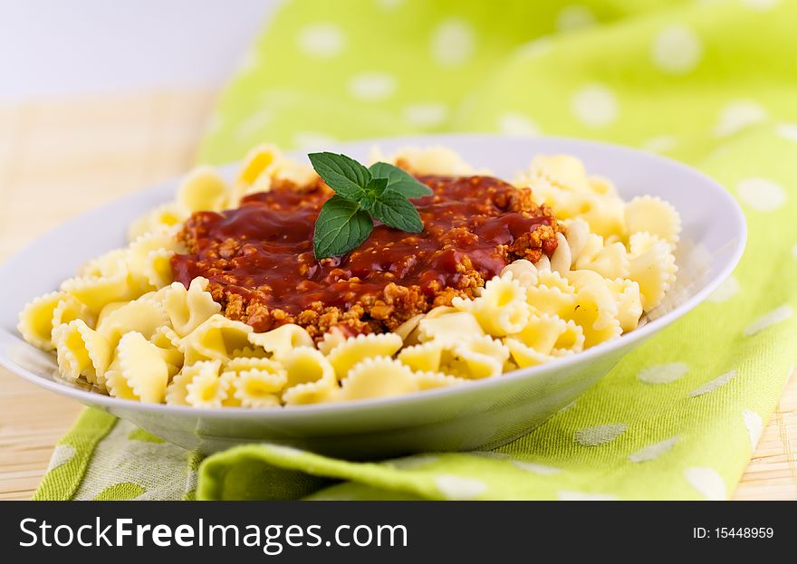 Spaghetti serve on plate with chopped meats