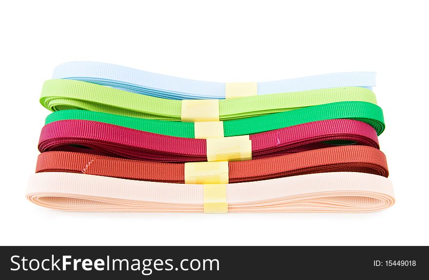 Various colorful ribbons for dressmaking and home crafts. Isolated over white background. Various colorful ribbons for dressmaking and home crafts. Isolated over white background.