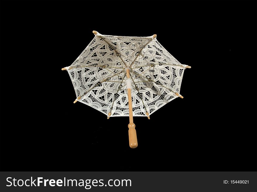 Lace parasol white closeup, isolated on black background