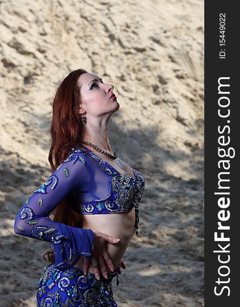 Belly dancer on the sand