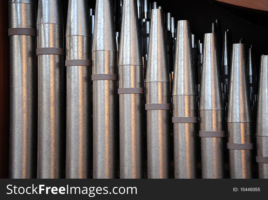 Church organ music pipes in a place of worship. Church organ music pipes in a place of worship.