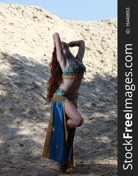 Belly dancer on the sand