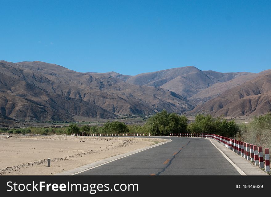 Yellowish mountain road view in tibet of China