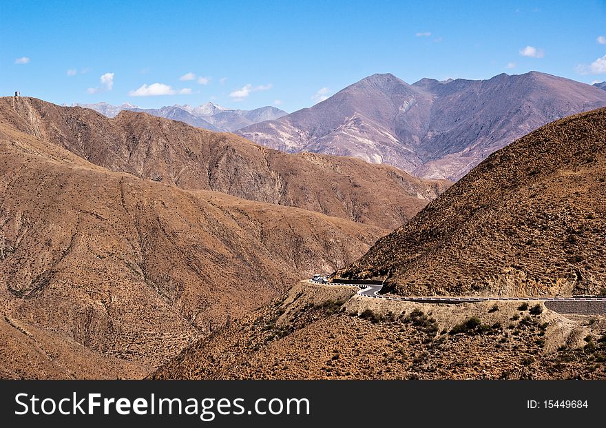 Yellowish mountain road view in tibet of China