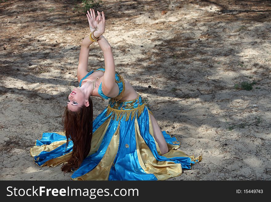 Belly dancer on the sand