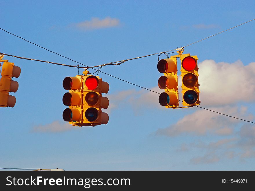 Three redlights on a wire chilling. Three redlights on a wire chilling.