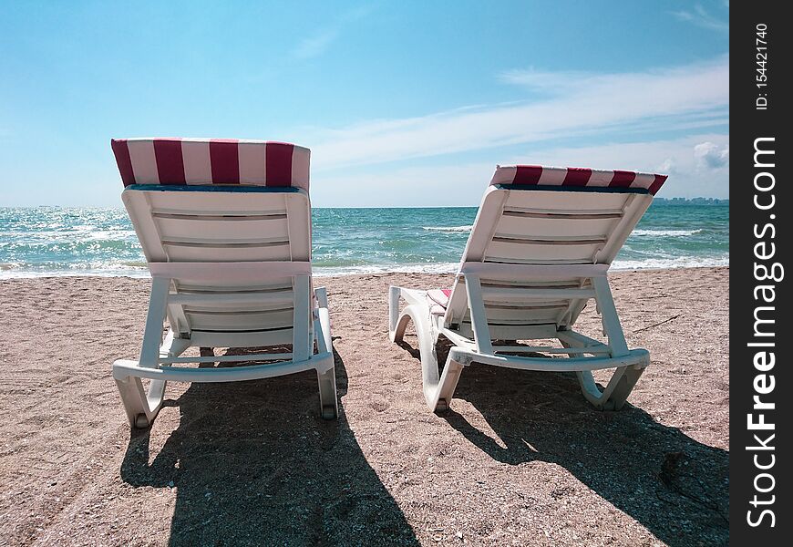 Beautiful bright blue seascape: sky, clouds, water, waves, sand, wind. Super nature. Wonderful vacation and travel