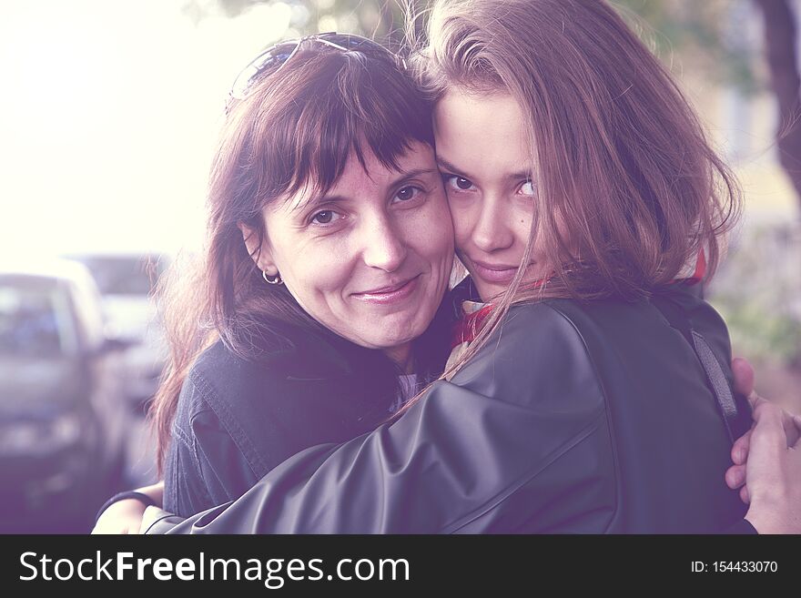Mother`s day, mother hugs her beloved daughter. Moment with mother