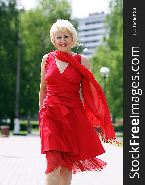 Walking woman in red dress