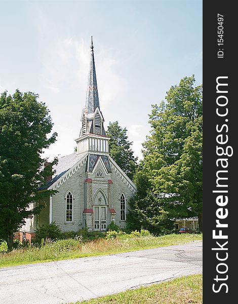A beautiful old church with lots of detail sits in a small glen in Vermont. A beautiful old church with lots of detail sits in a small glen in Vermont.
