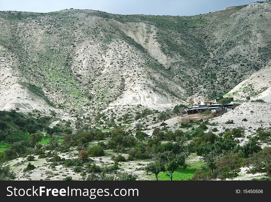 Cyprus landscape with hills,trees and house. Cyprus landscape with hills,trees and house.
