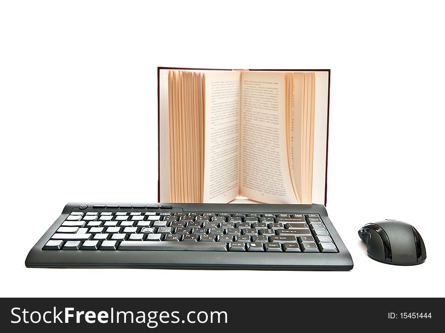 Black keyboard near opened book. Isolated on white. Black keyboard near opened book. Isolated on white