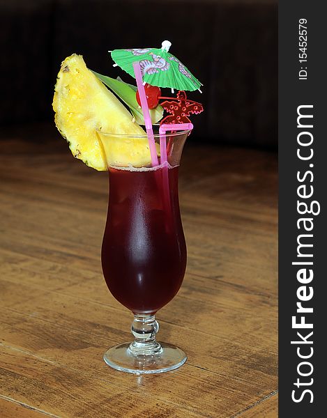 Red delicious cocktail with pineapple