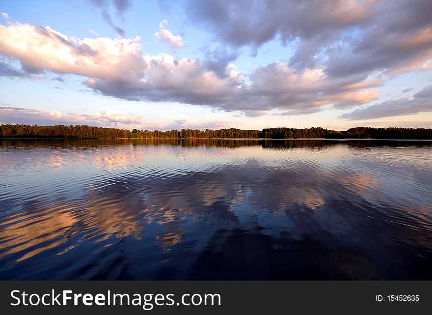 Lake in the evening and shadows on it. Lake in the evening and shadows on it