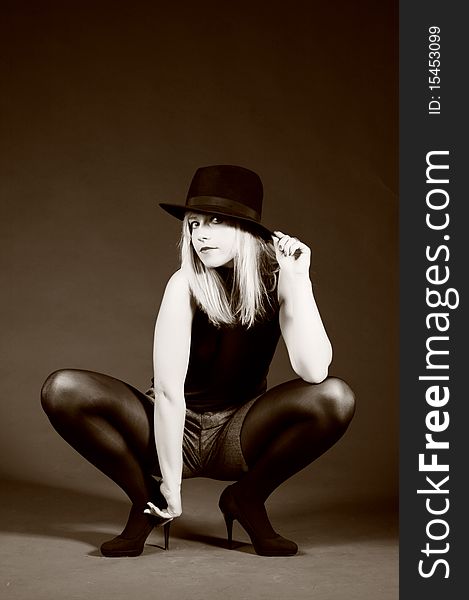 Provocative blonde woman with hat. Fashion art photo. Provocative blonde woman with hat. Fashion art photo