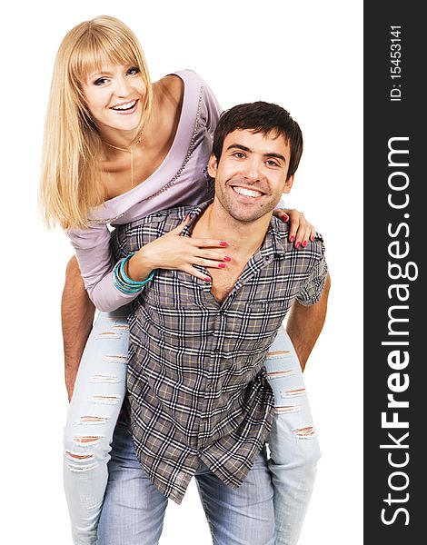 Cheerful young couple in casual clothing, white background