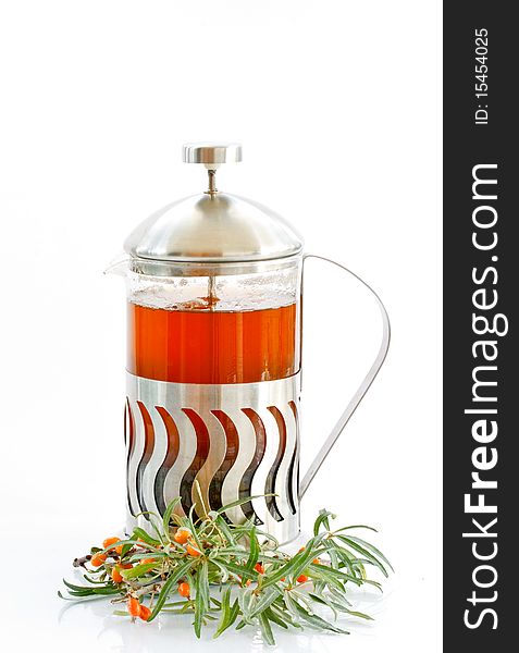 Tea and sea buckthorn is isolated on a white background