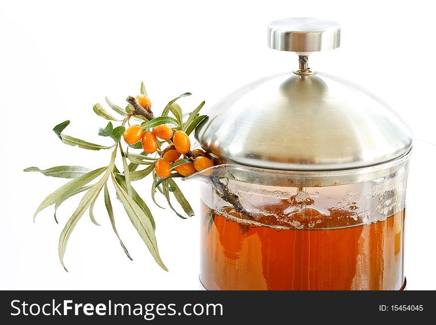 Tea and sea buckthorn is isolated on a white background