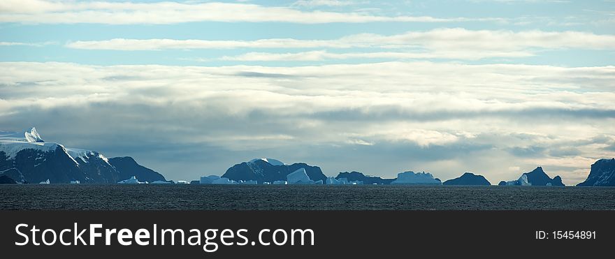 Southern Orkney Islands in antarctic area. Island and icebergs.