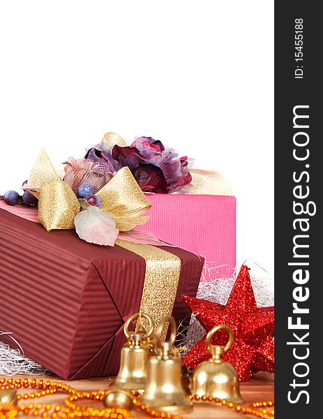 Close-up view of Christmas presents and ornaments over white background with copyspace