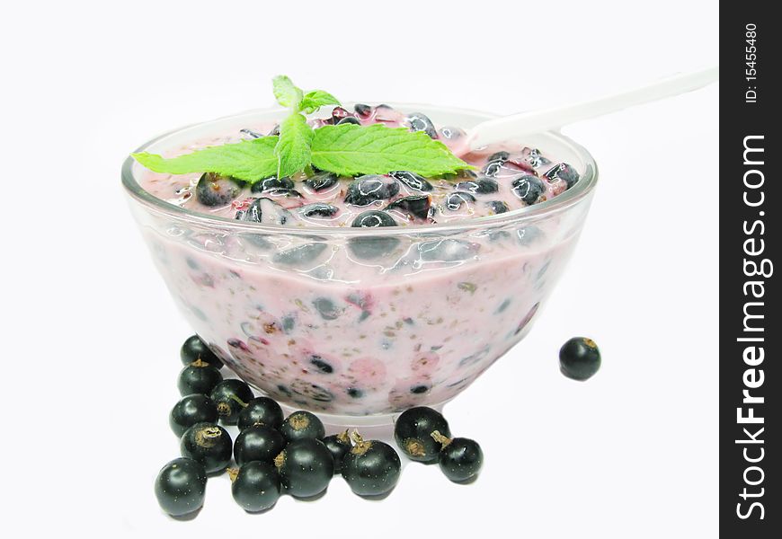 Bowl of yogurt with black currant healthy dessert