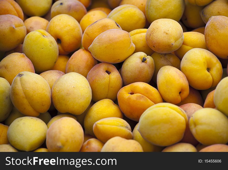 Fresh yellow apricots on the market