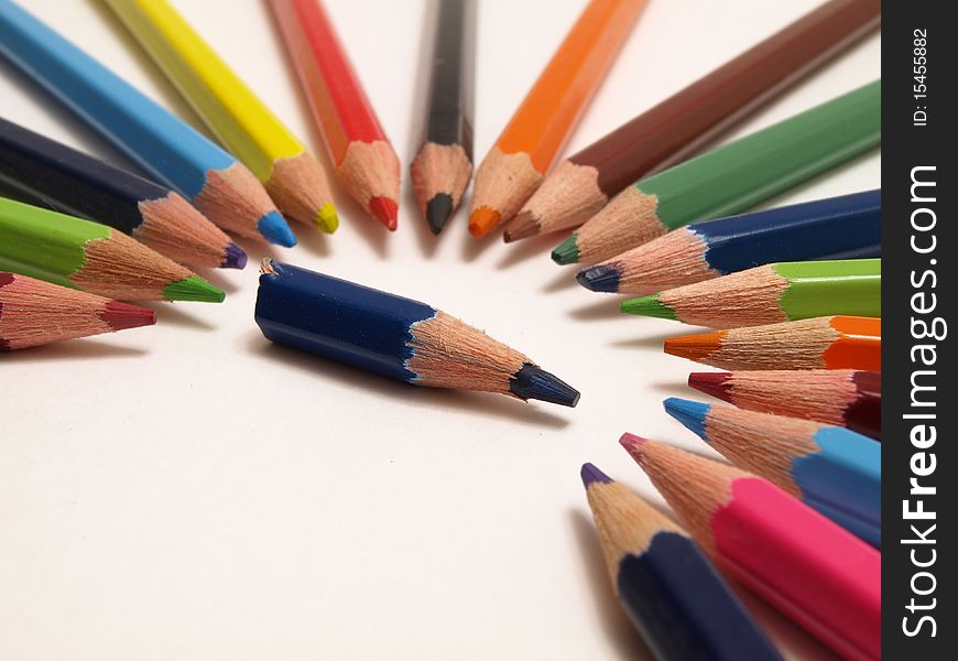 Close up of color pencils with different color over white background. Close up of color pencils with different color over white background.