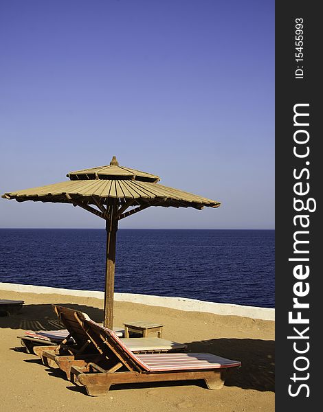 Empty sunbathe and beach umbrella in Sharm El Sheik. Empty sunbathe and beach umbrella in Sharm El Sheik