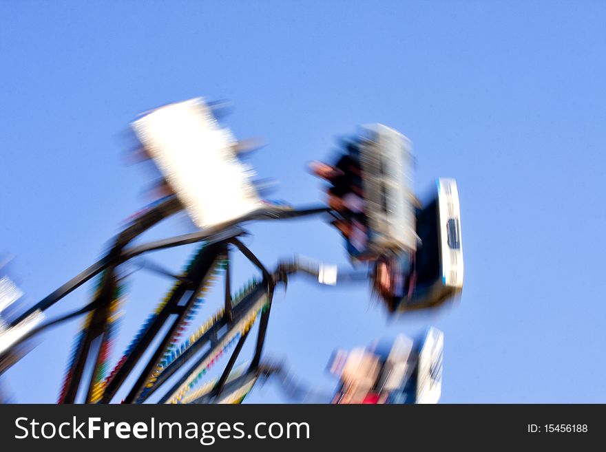 Carnival ride at fairground with blurred motion