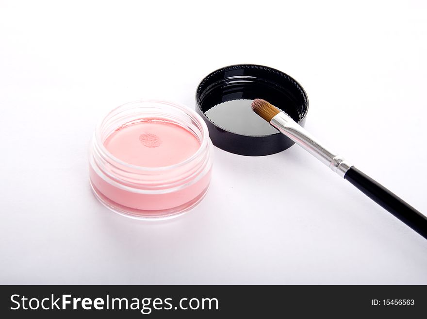 A open blusher,a brush on its lid. A open blusher,a brush on its lid