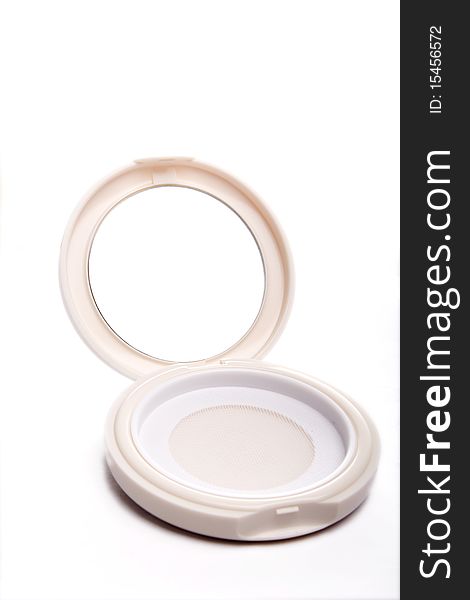 A opened cosmetic mirror on white background