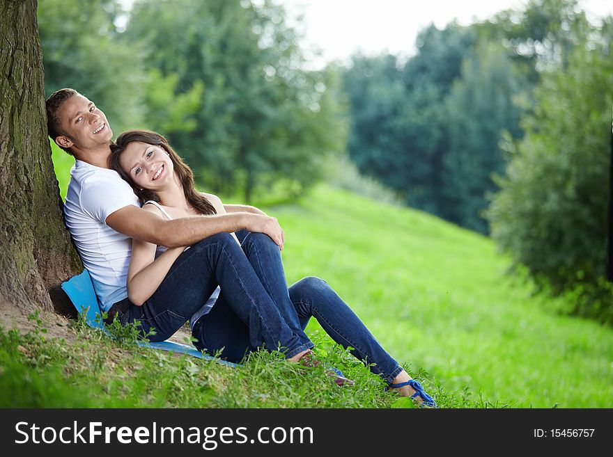 Young couple in love with a tree. Young couple in love with a tree