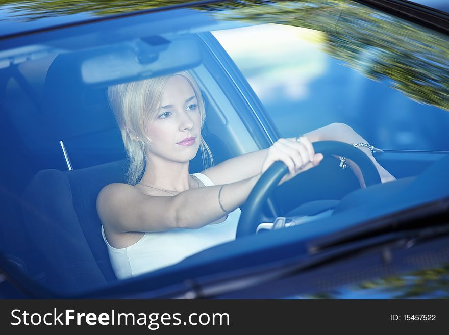 Young attractive girl behind the wheel. Young attractive girl behind the wheel