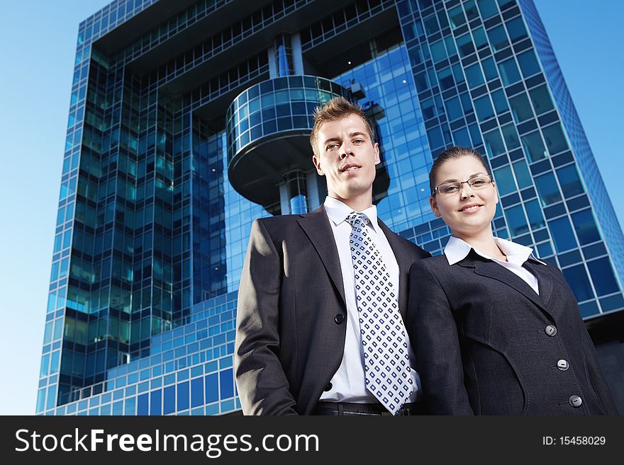 Business people on the background of the business buildings. Business people on the background of the business buildings