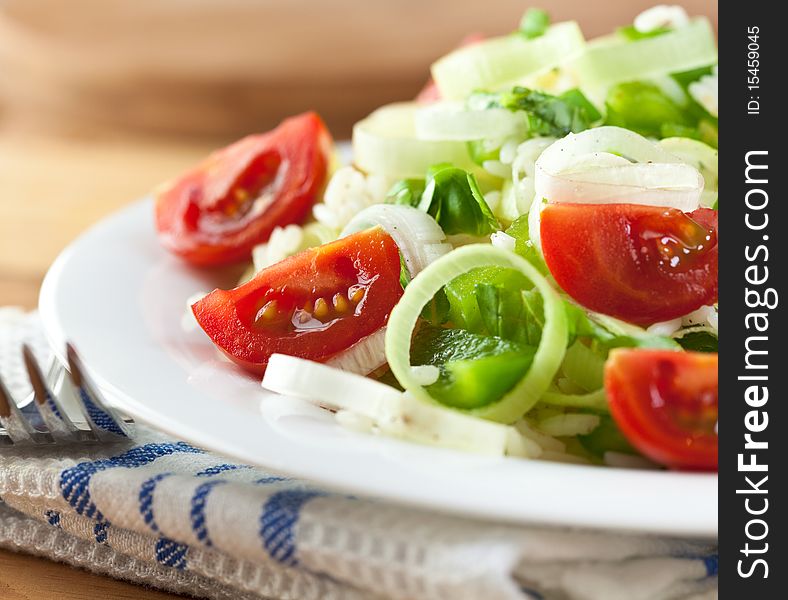 Rice salad with cherry tomatoes,pepper,leek and fresh basil. Rice salad with cherry tomatoes,pepper,leek and fresh basil