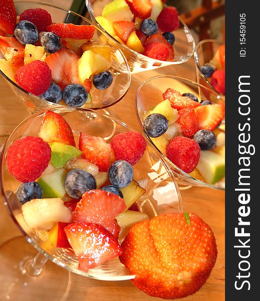 Multicolored fresh summer fruit-dessert closeup. Multicolored fresh summer fruit-dessert closeup