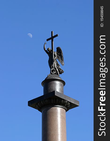Figure of Аngel holding a cross on the top of Alexander Column on Winter Palace square in Saint-Petersburg, Russia