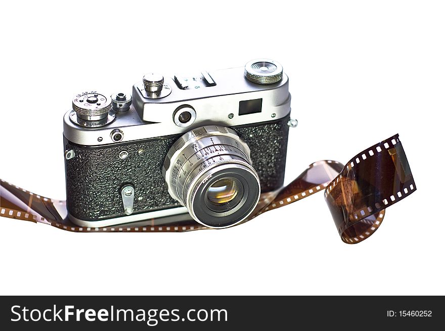 Retro film camera is shown on 35mm film. White background, isolation. Medium-format camera with interchangeable lenses.