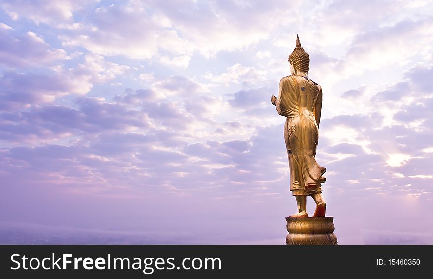 Walking Buddha statue