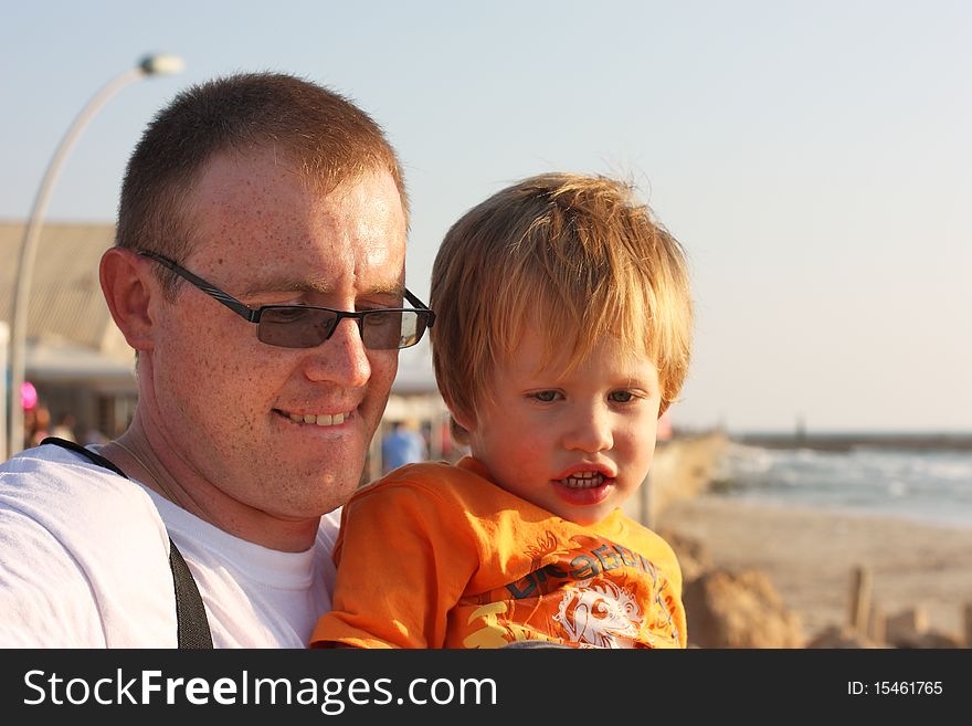 Father with son on the sea